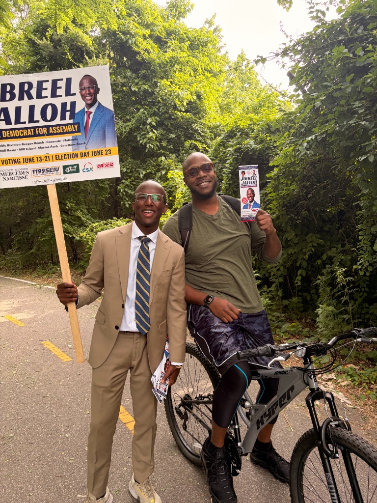 Julius Stukes Jr. with Jibreel Jalloh meeting voters